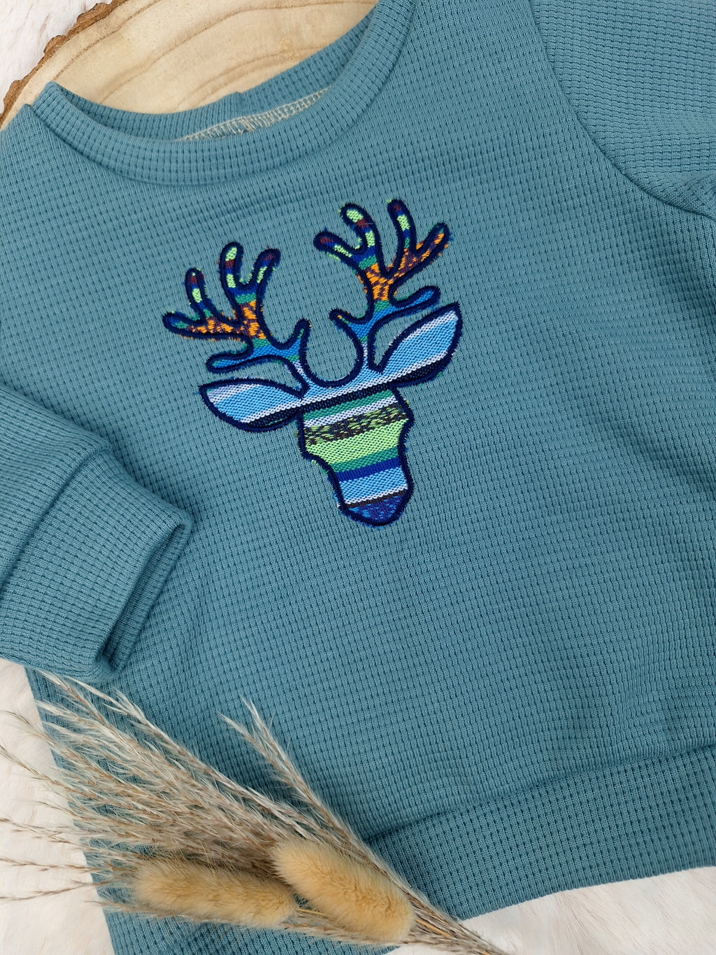Weihnachtspullover mit Rentier-Applikation